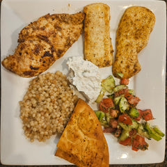 Chicken Mediterranean Mezze Platter with Grilling Cheese, Tomato Cucumber Salad,  Couscous and Pita Chips